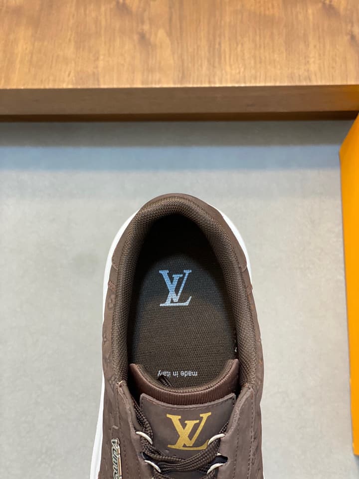 Louis Vuitton Embossed Calfskin Sneakers in Black