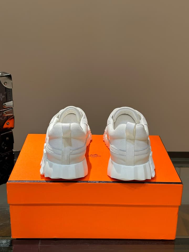 Hermès Bouncing Calfskin Mesh Sneakers in Black With White Stripe