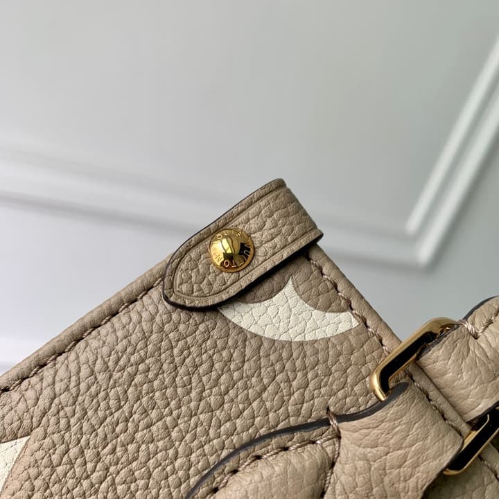Louis Vuitton OnTheGo BB Monogram Empreinte Handbag in Beige And Cream Monogram
