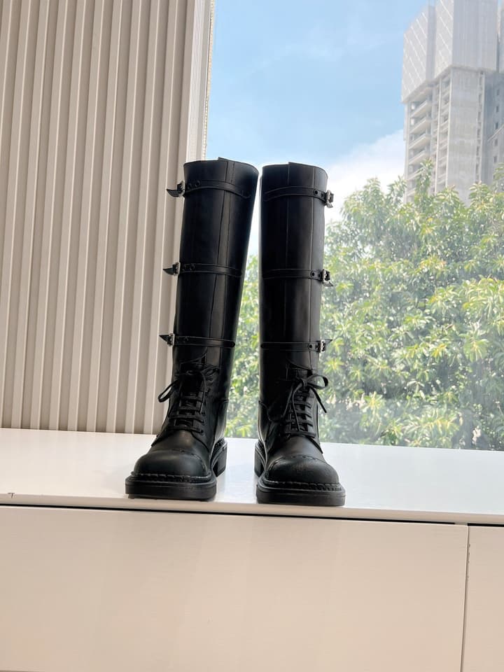 Miu Miu Distressed Biker Knee-High Boots – Autumn/Winter Runway Edition in Distressed Black Moto Boots