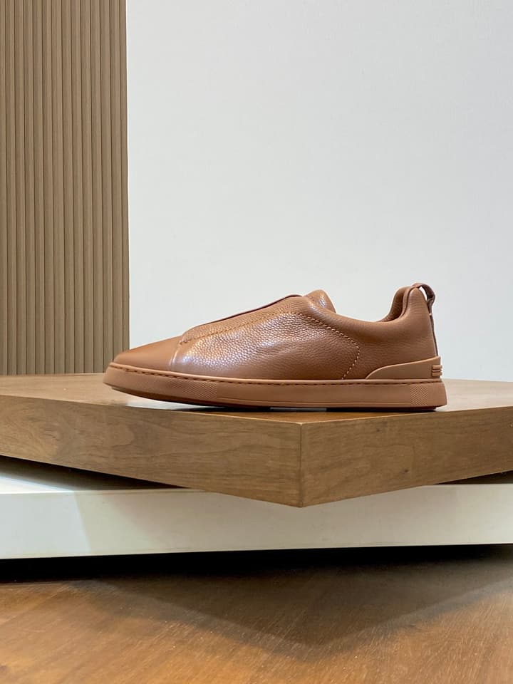 Ermenegildo Zegna Triple Stitch Sneakers in Black Leather With Brown Tag