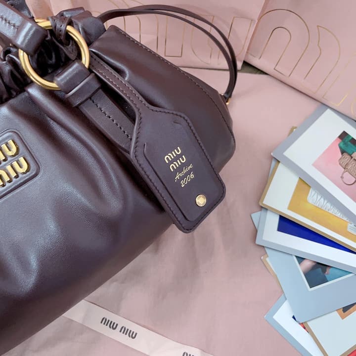 Miu Miu Tassel Drawstring Bucket Bag – New Collection in Black