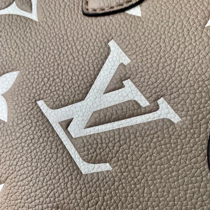 Louis Vuitton OnTheGo BB Monogram Empreinte Handbag in Beige And Cream Monogram