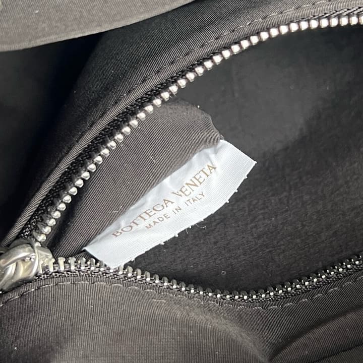 Bottega Veneta Intrecciato Grained Pouch in Black Woven Leather