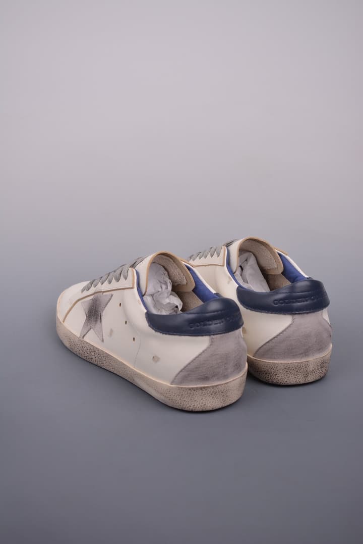 Golden Goose Super Star Distressed Sneakers – 2023 Collection in White With Navy Heel