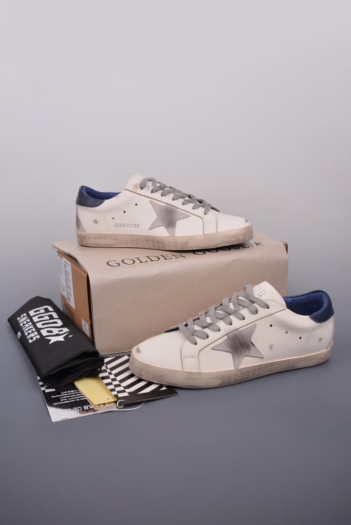 Golden Goose Super Star Distressed Sneakers – 2023 Collection in White With Navy Heel