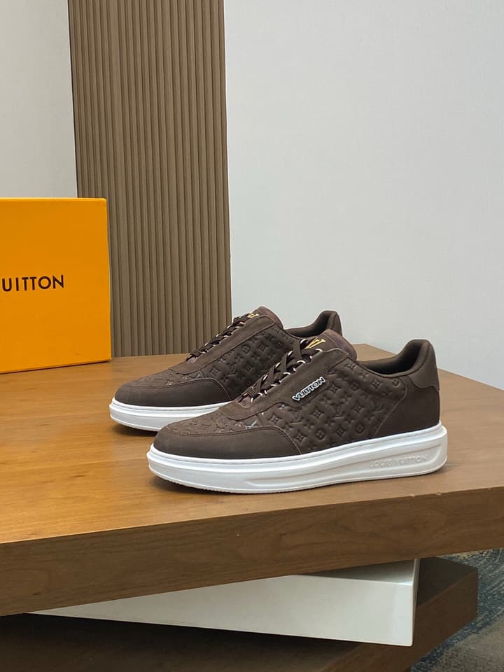 Louis Vuitton Embossed Calfskin Sneakers in Black