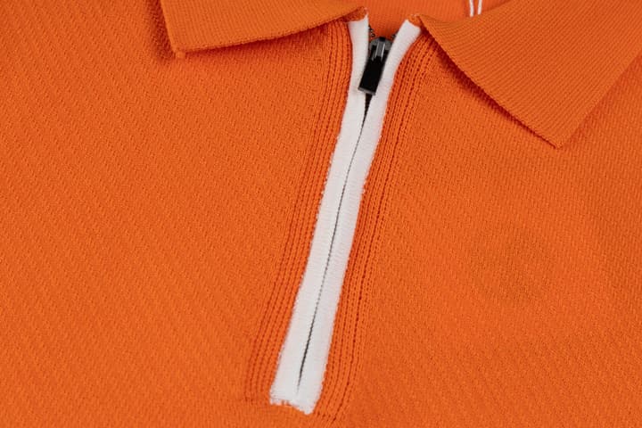 Hermès Retro Knitted Polo Shirt – SS24 in Black Polo With Orange Placket
