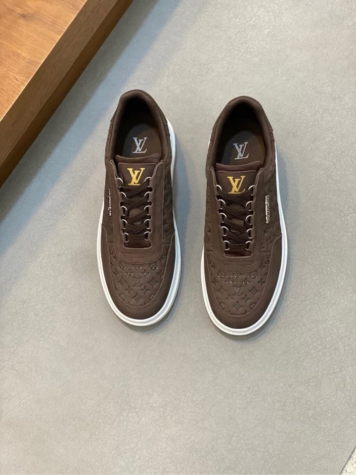 Louis Vuitton Embossed Calfskin Sneakers in Black