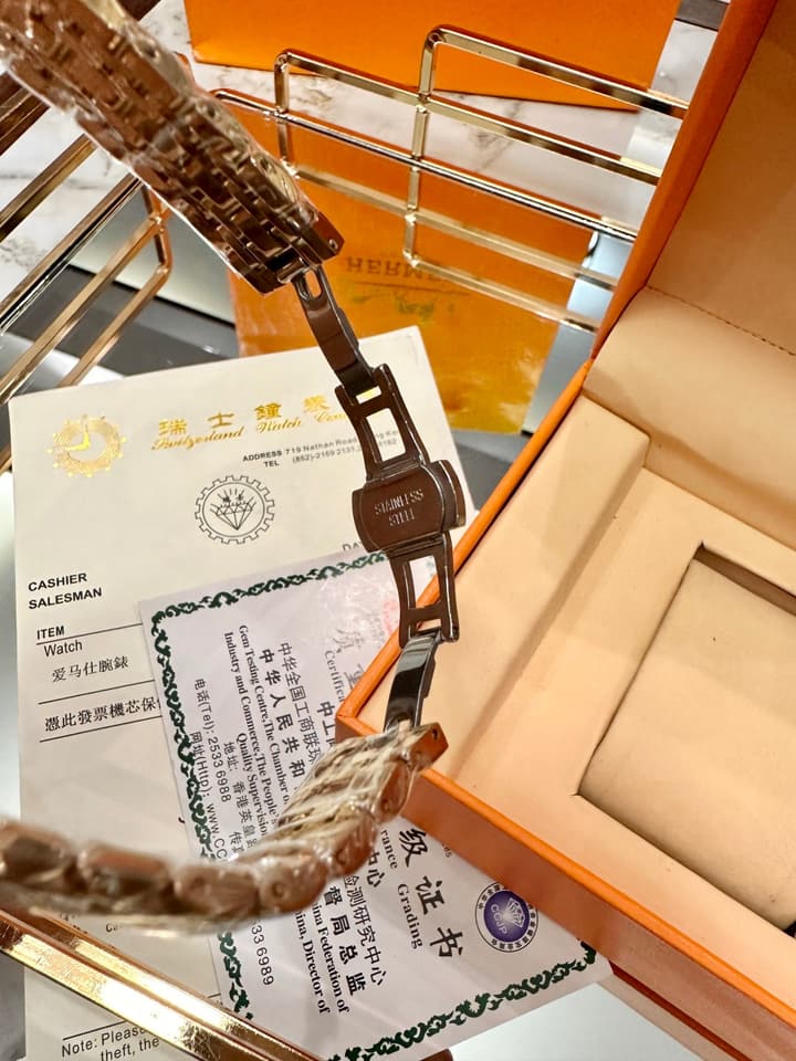 Hermès Small Square Luxury Watch in Dark Dial Patterned Gold Bracelet