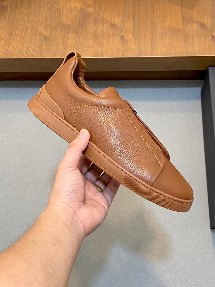 Ermenegildo Zegna Triple Stitch Sneakers in Black Leather With Brown Tag