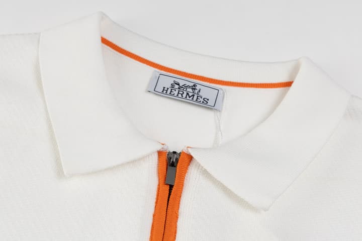 Hermès Retro Knitted Polo Shirt – SS24 in Black Polo With Orange Placket