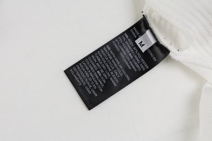 Hermès Retro Knitted Polo Shirt – SS24 in Black Polo With Orange Placket