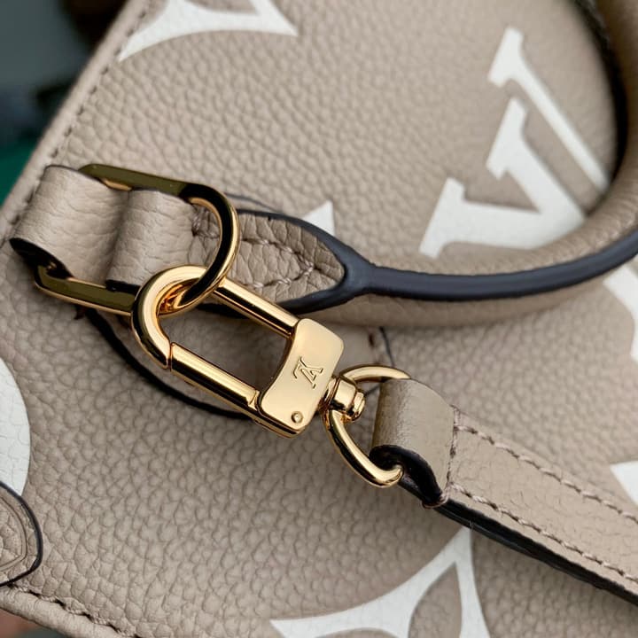 Louis Vuitton OnTheGo BB Monogram Empreinte Handbag in Beige And Cream Monogram