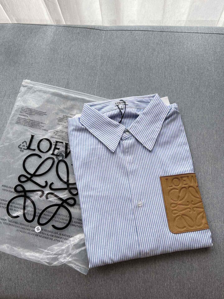 Loewe Embossed Logo Suede Pocket Striped Shirt in Tan Loewe Pouch, Light Blue Overshirt, Black Skirt - View 1