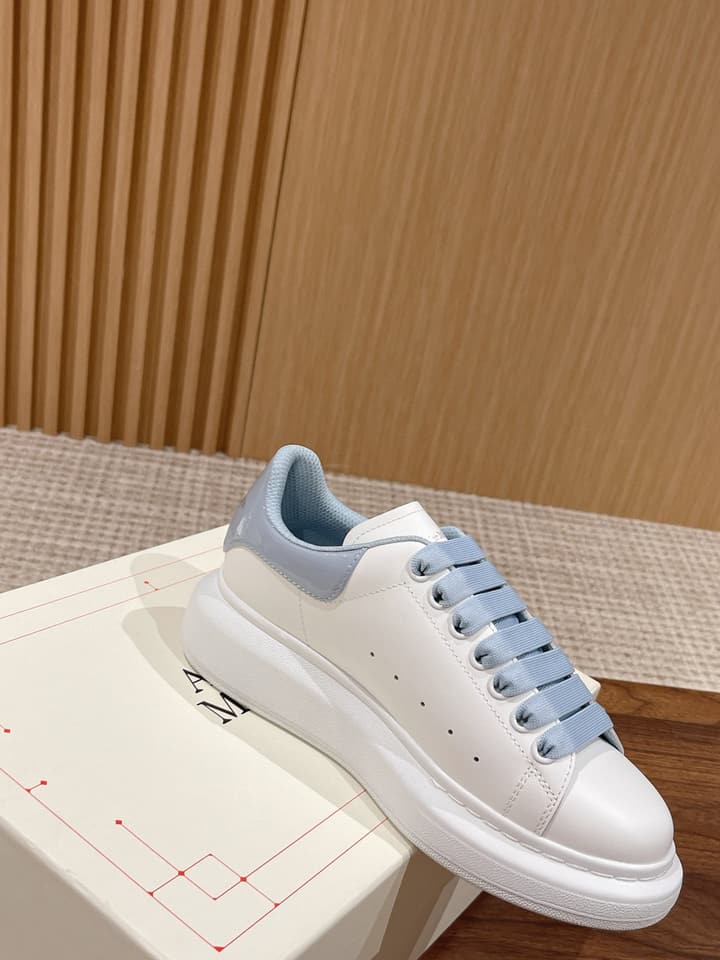 Alexander McQueen Classic Versatile White Sneakers in White With Black Laces & Heel
