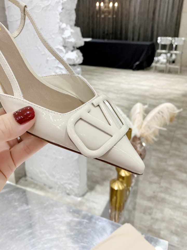 Valentino VLogo Pointed-Toe Patent Leather Pumps in Black Patent