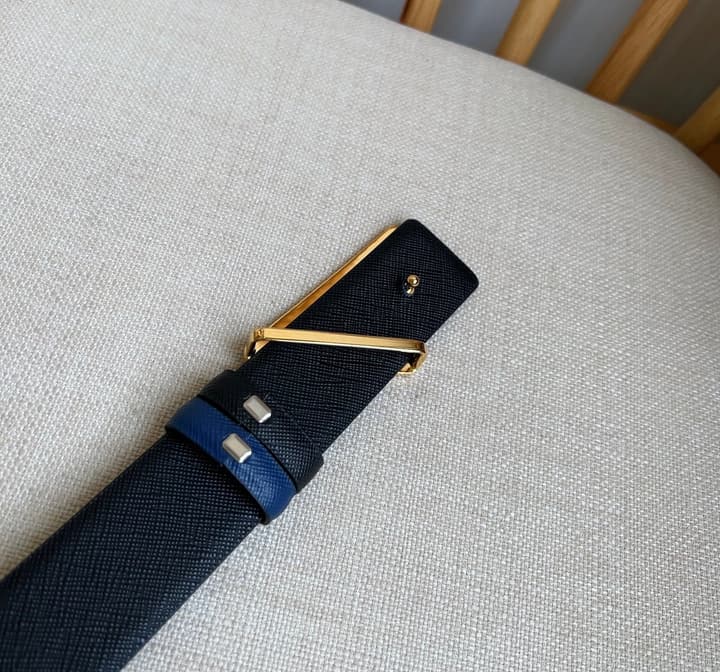 Prada Triangle Logo Buckle Belt in Black Textured Leather With Black Buckle