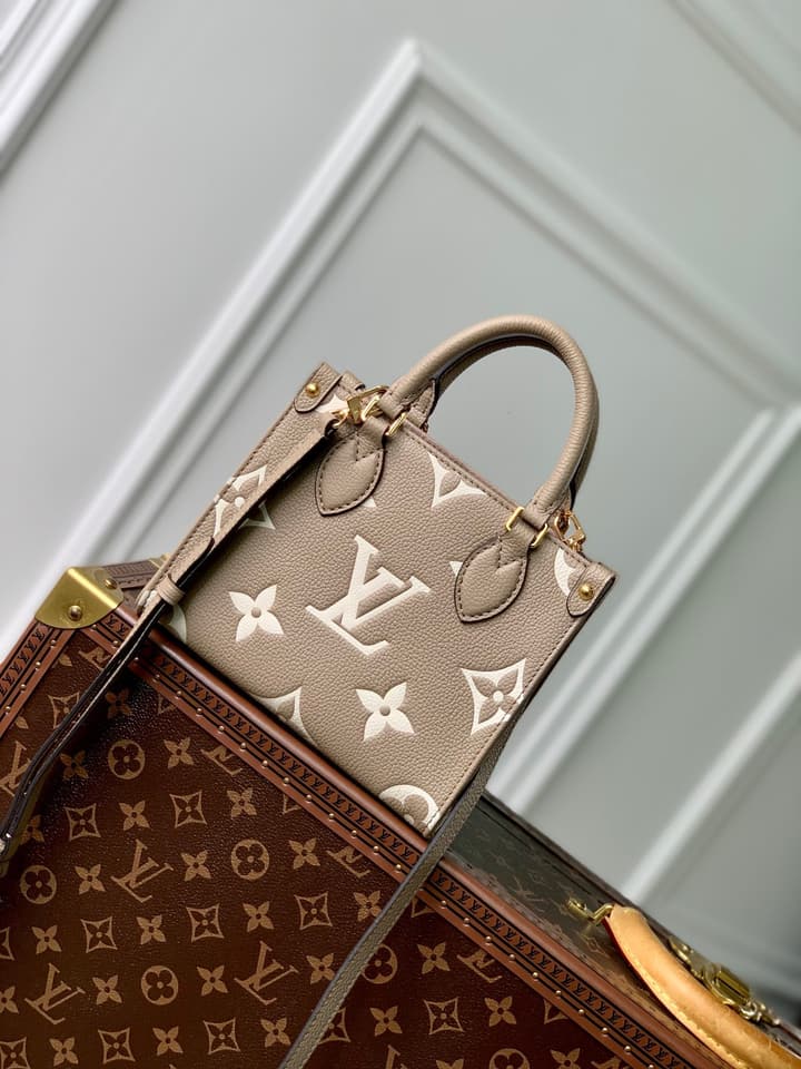 Louis Vuitton OnTheGo BB Monogram Empreinte Handbag in Beige And Cream Monogram