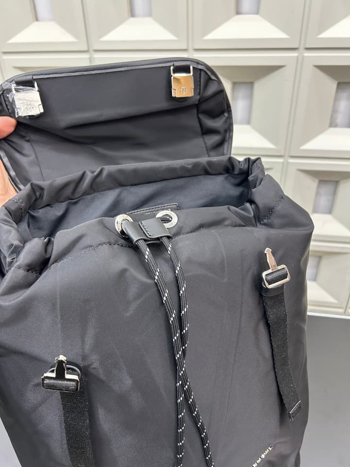 RIMOWA Signature Series Flap Drawstring Backpack in Classic Black