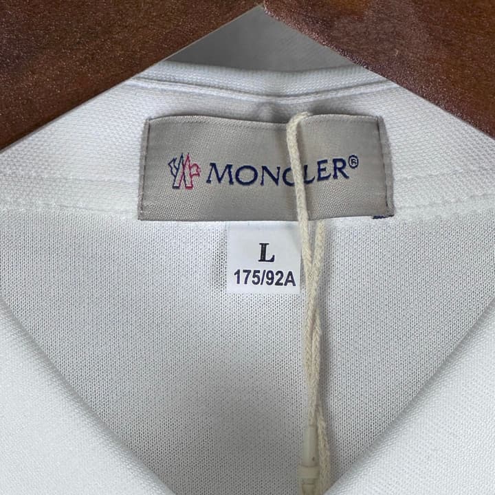 Moncler Classic Embroidered Long-Sleeve Polo Shirt in Black Polo - Hanging Display