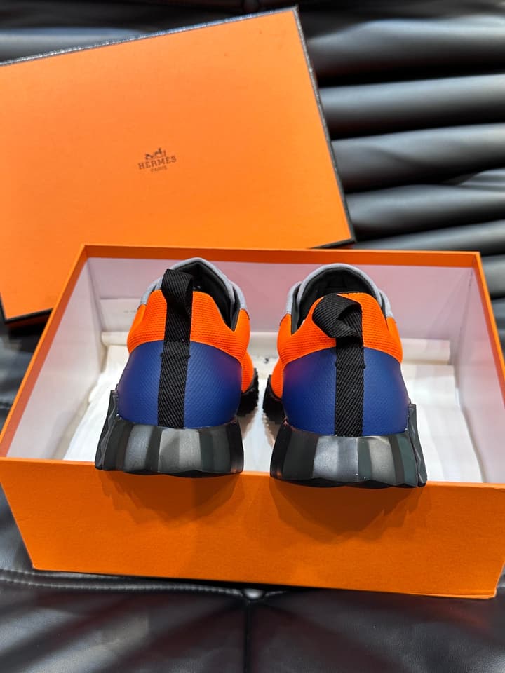 Hermès Bouncing Calfskin Mesh Sneakers in Black With White Stripe