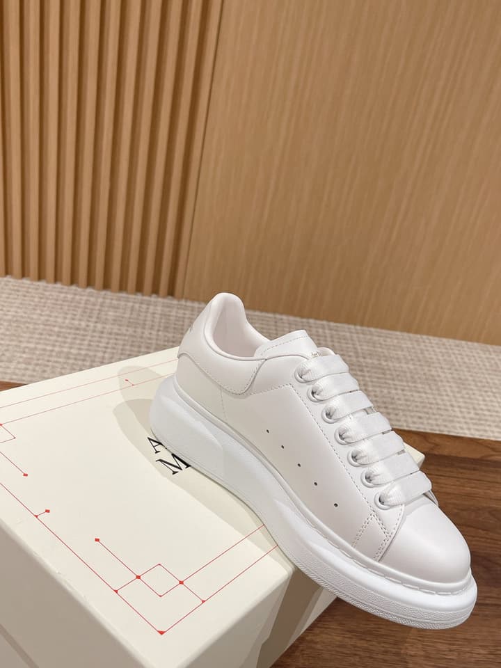 Alexander McQueen Classic Versatile White Sneakers in White With Black Laces & Heel