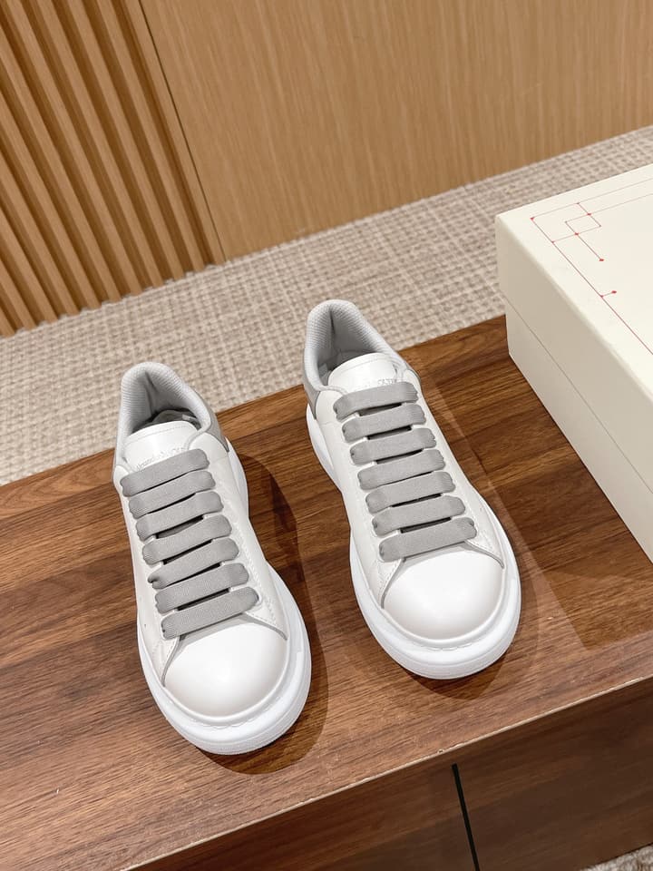 Alexander McQueen Classic Versatile White Sneakers in White With Black Laces & Heel