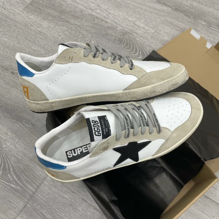 Golden Goose Ball Star Distressed Sneakers – 2023 Spring Collection in White Distressed With Blue Heel And Black Star