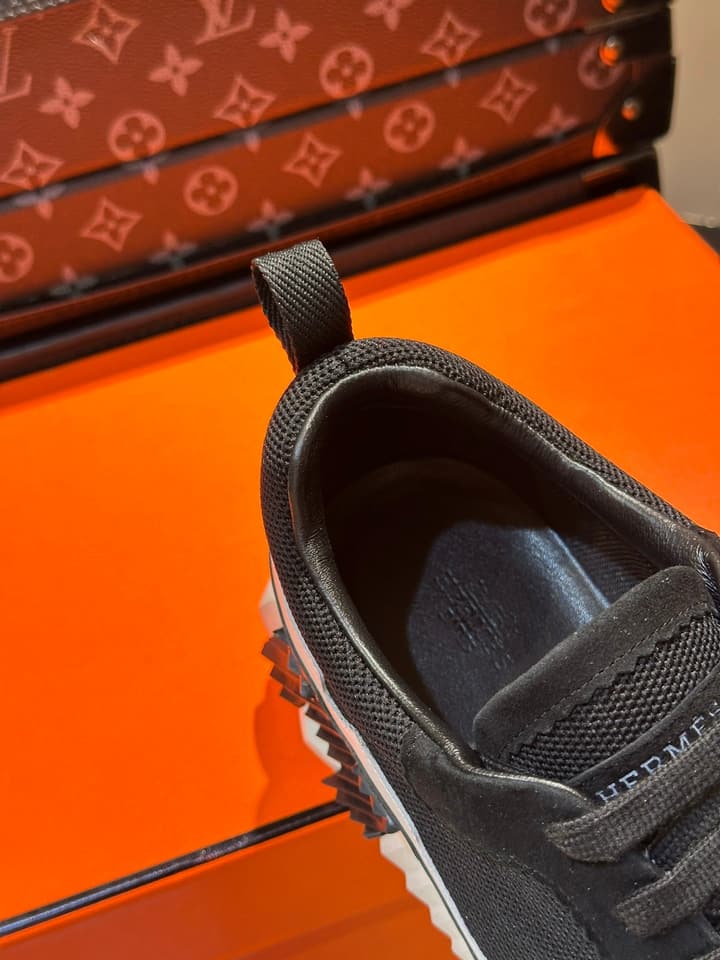Hermès Bouncing Calfskin Mesh Sneakers in Black With White Stripe