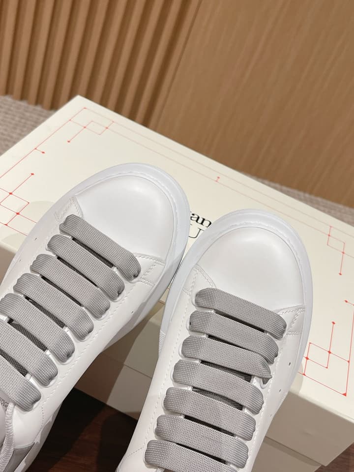 Alexander McQueen Classic Versatile White Sneakers in White With Black Laces & Heel