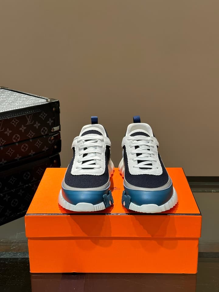 Hermès Bouncing Calfskin Mesh Sneakers in Black With White Stripe