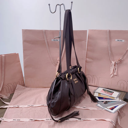 Miu Miu Tassel Drawstring Bucket Bag – New Collection
