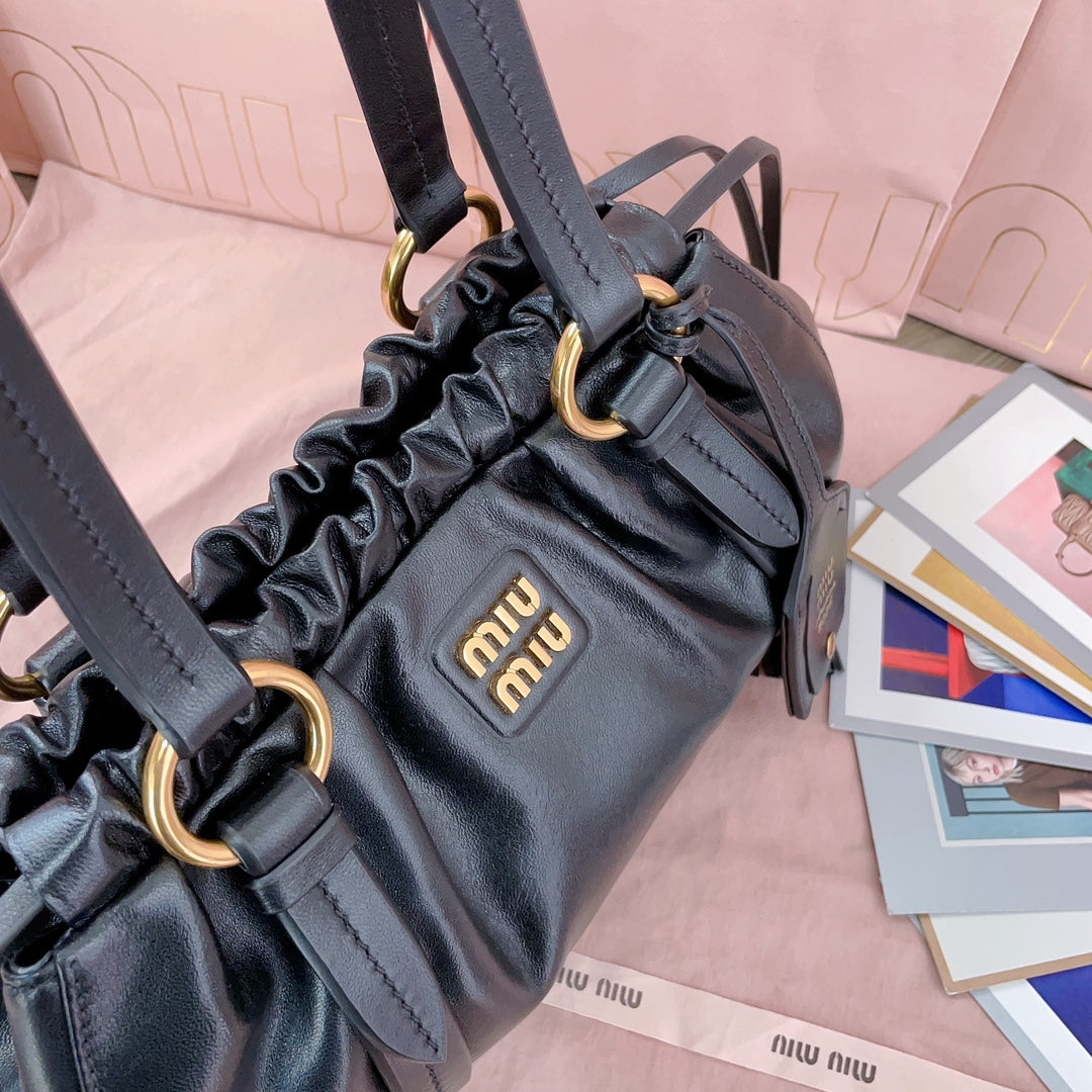 Miu Miu Tassel Drawstring Bucket Bag – New Collection
