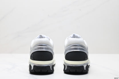 Chanel Leather Logo Low-Top Sneakers