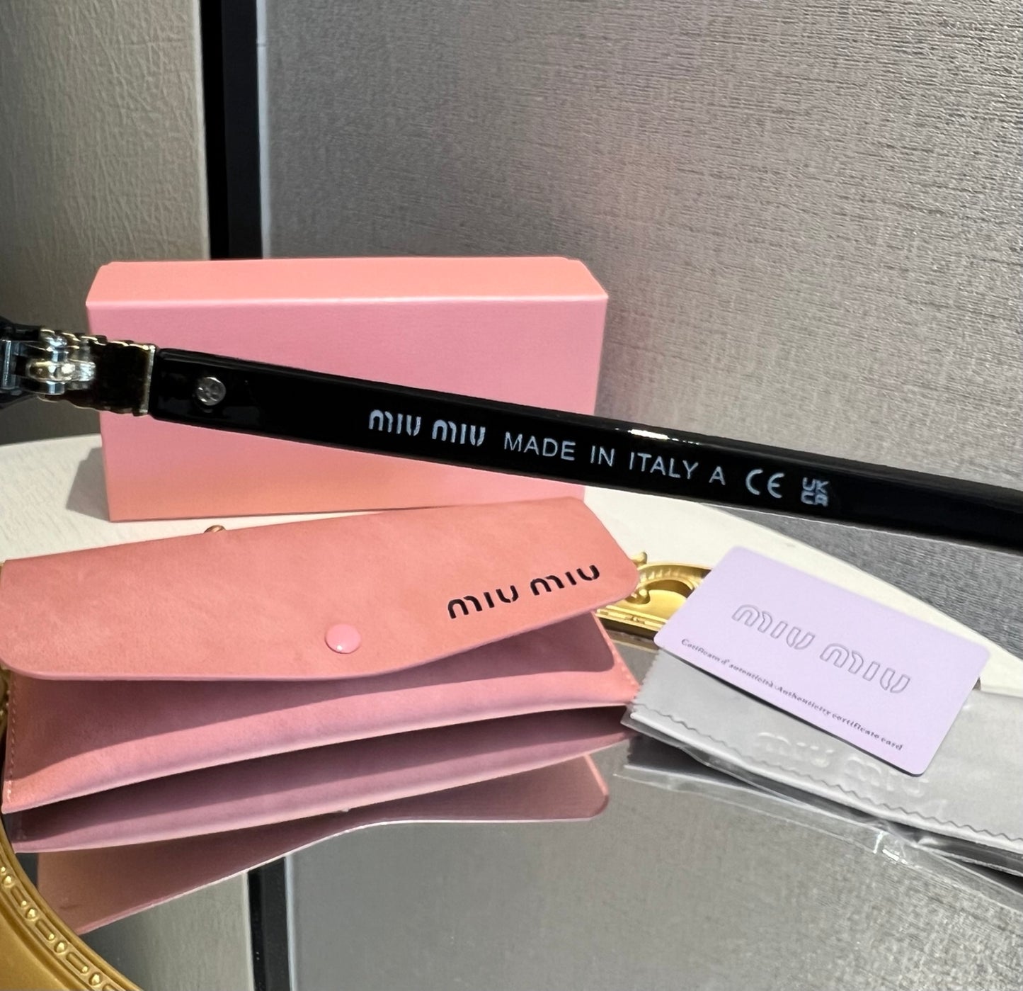 Miu Miu Retro Oval Sunglasses