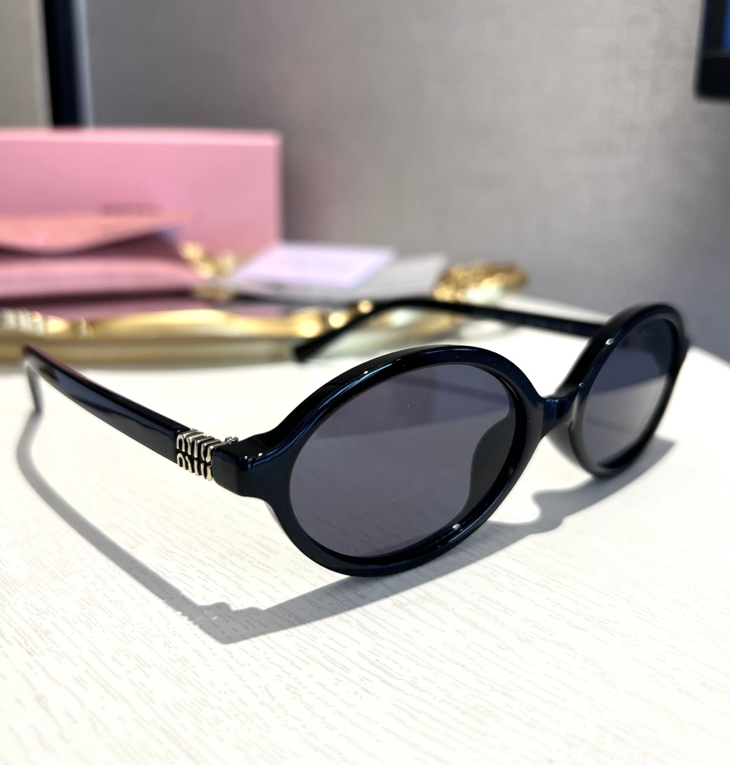 Miu Miu Retro Oval Sunglasses